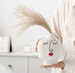 Vase en céramique en forme de visage